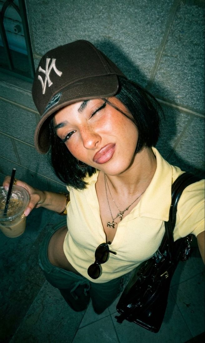 Night flash look: a selfie restyled with harsh digicam flash against a dark background